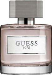 GUESS 1981 close-up of bottle cap and spray highlighting premium finish and precise dispensing benefit