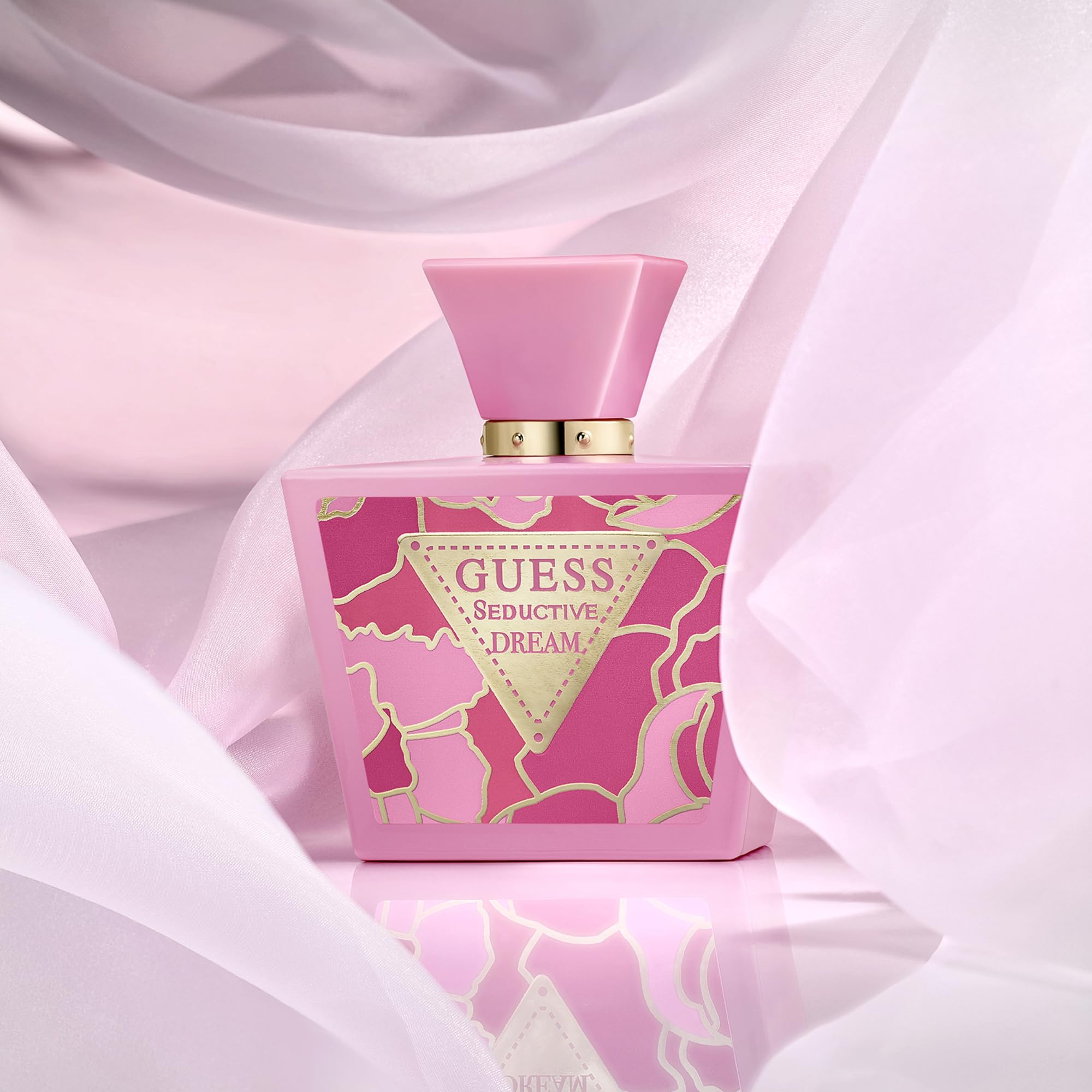 GUESS bottle on vanity with flowers suggesting feminine, everyday wear