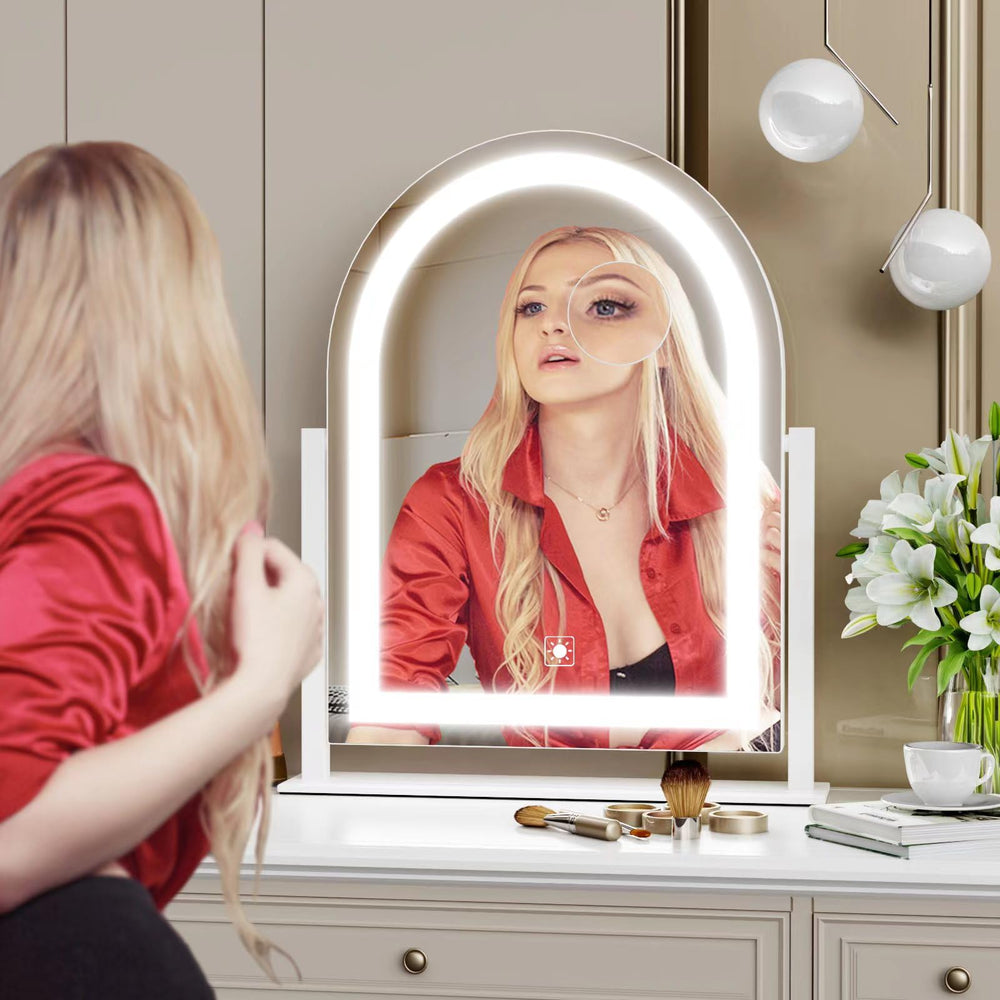 Gvnkvn mirror next to a hand showing compact size and tabletop fit