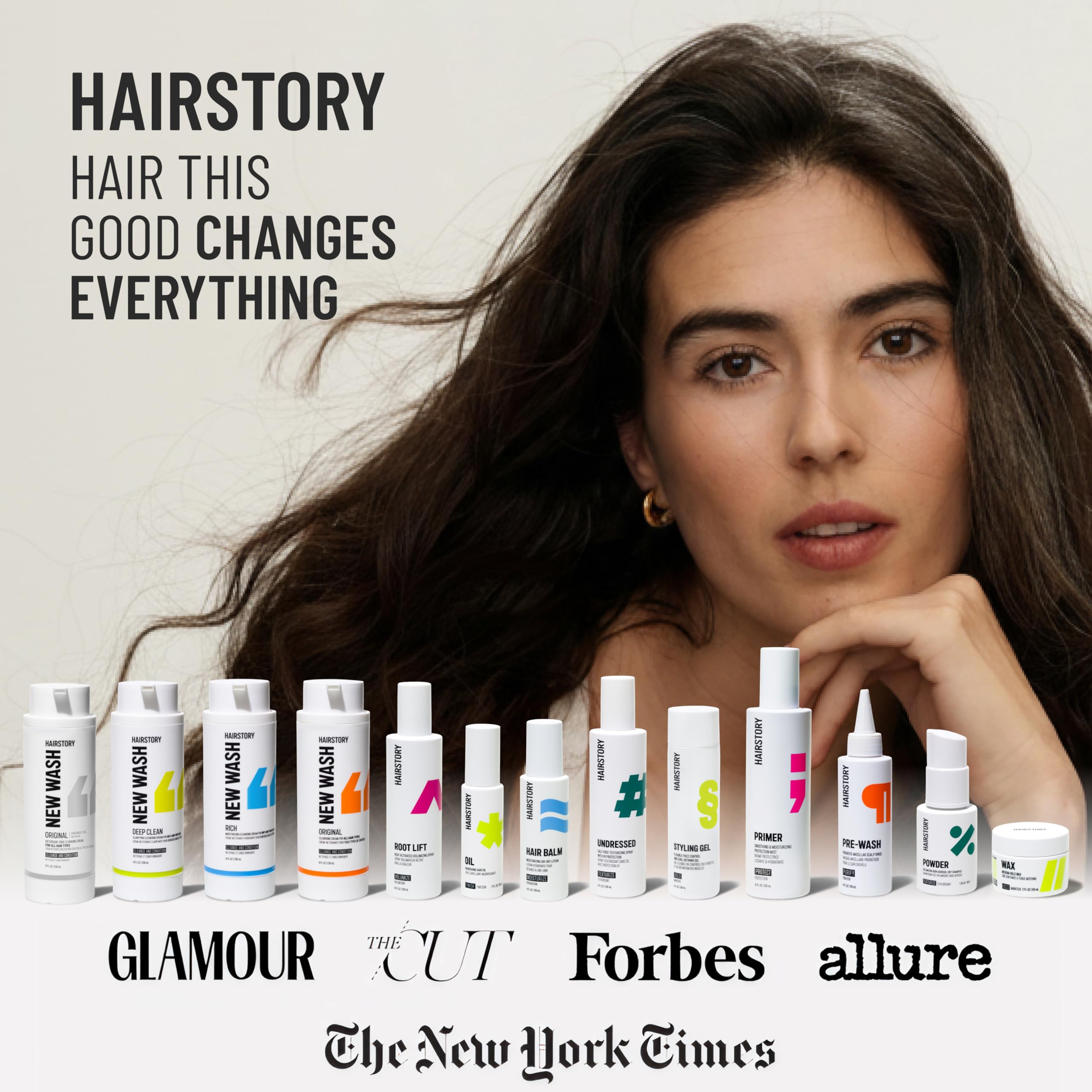 8 oz Hairstory bottle next to hand to show compact, travel-friendly size