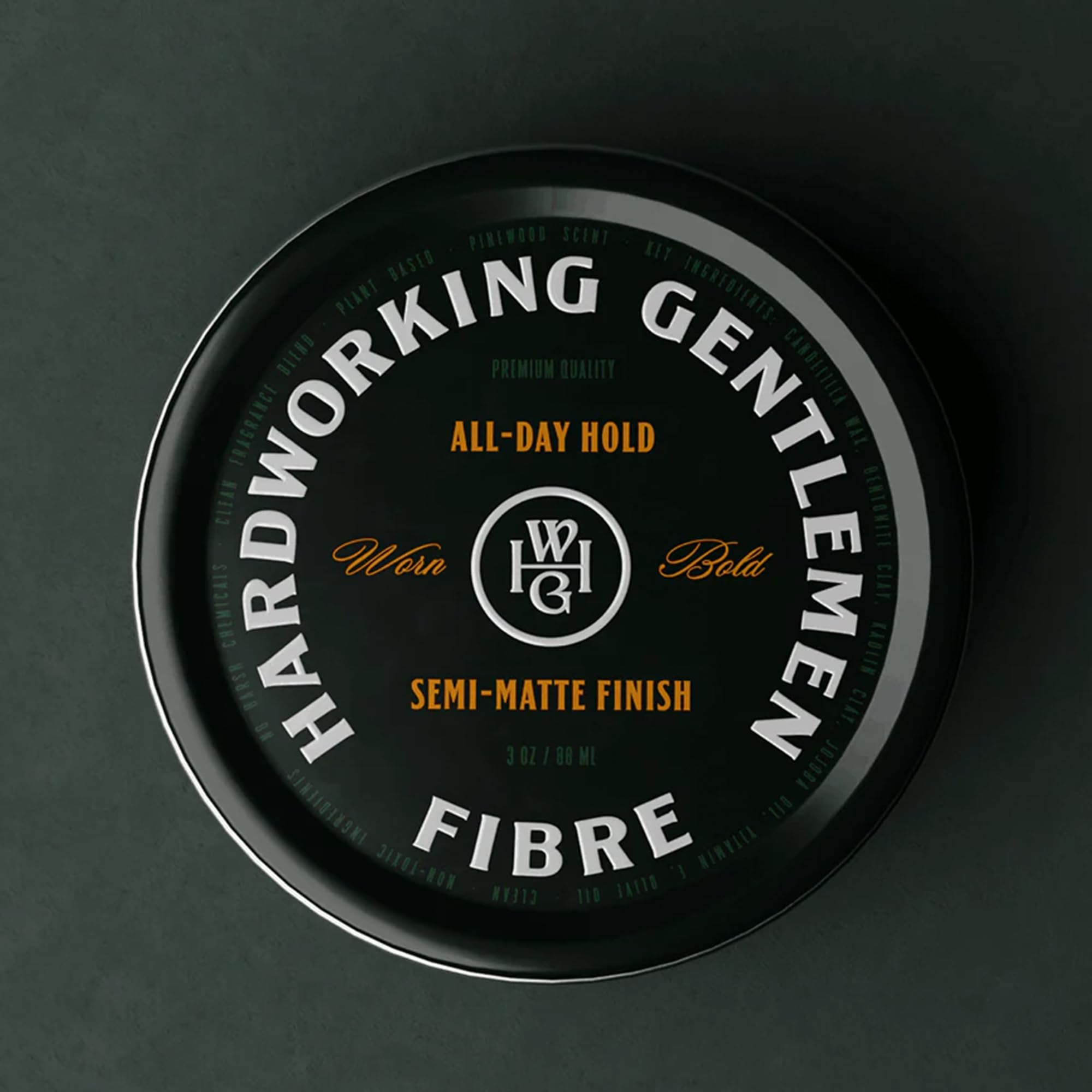 Hardworking Gentlemen tin in hand demonstrating compact 3 oz size