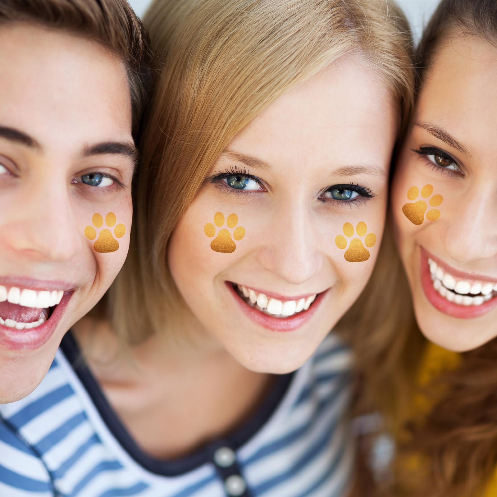 Children at a birthday party wearing Harloon gold paw tattoos, festive look