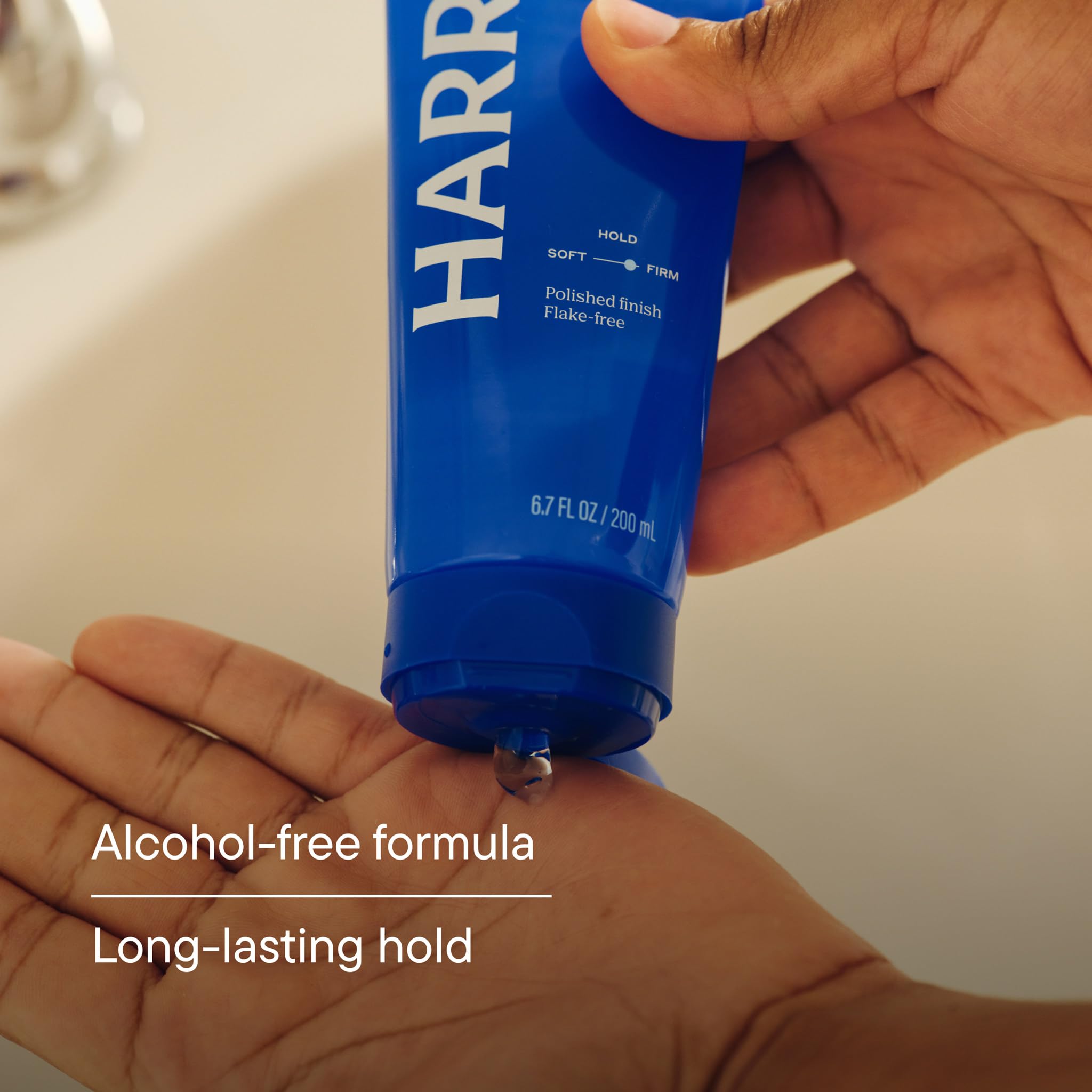 Harry's gel on hand being applied to hair for quick even distribution