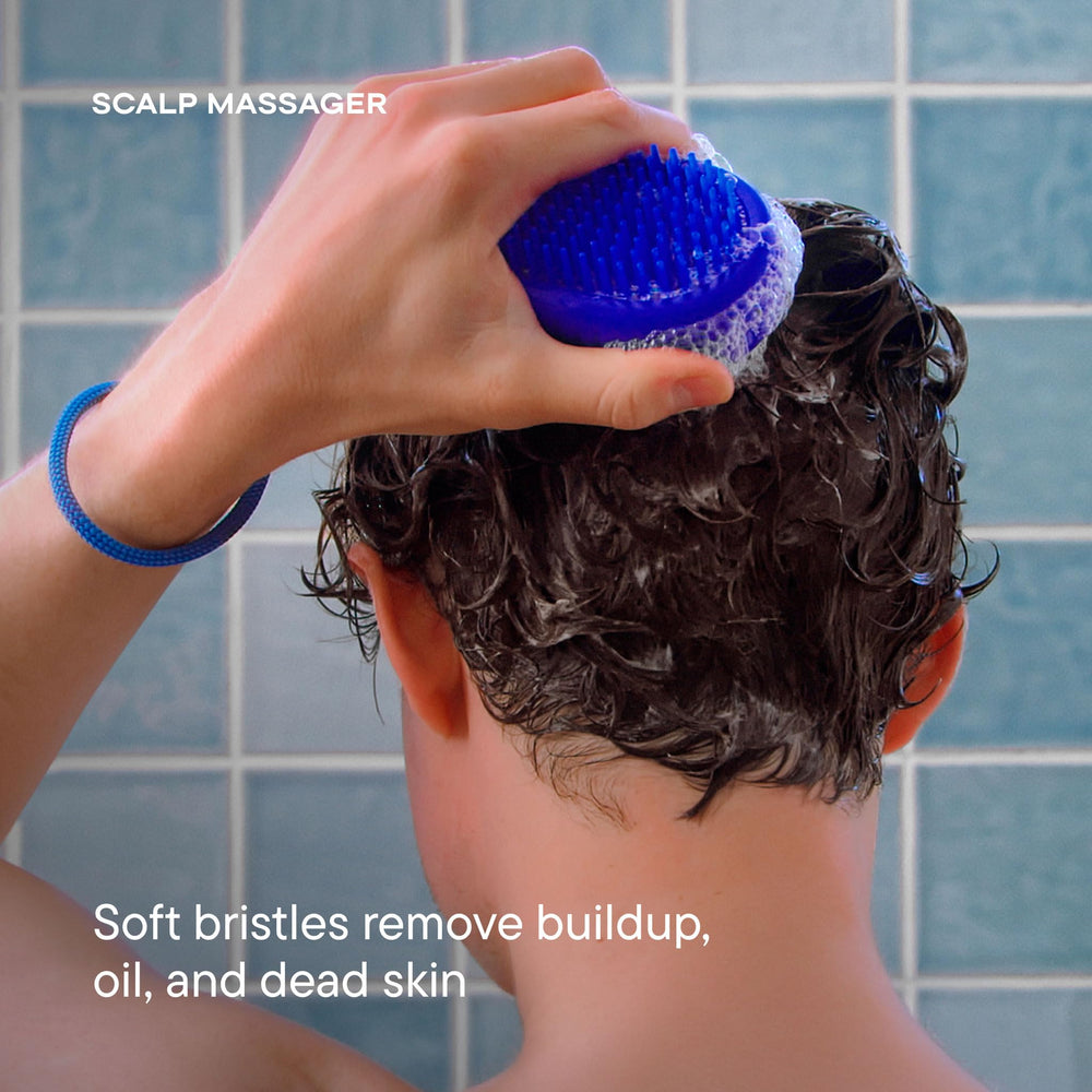 Harry's scrubber held in hand demonstrating ergonomic grip for control