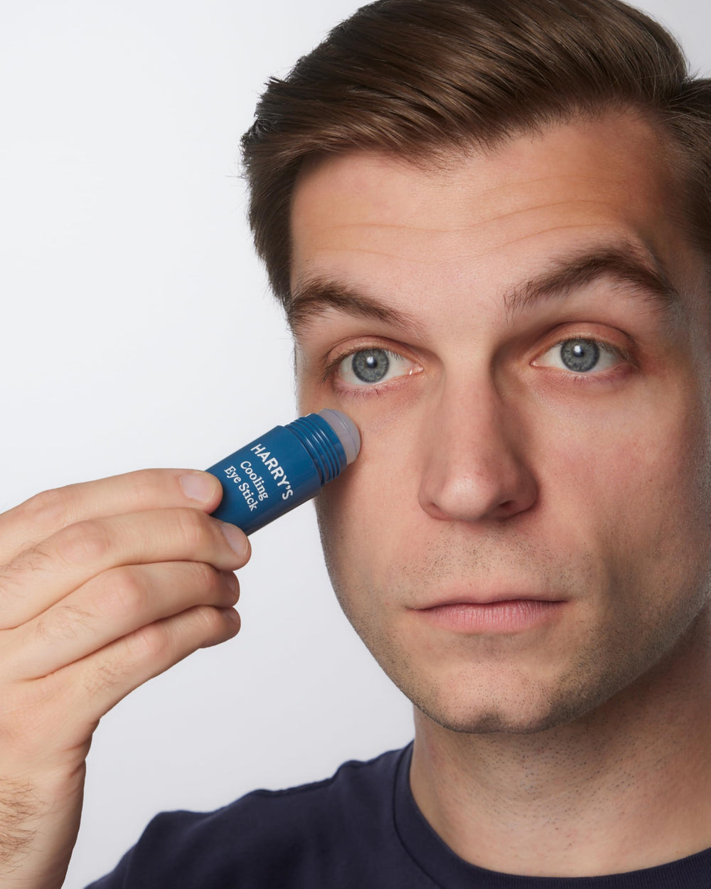 Harry's cooling eye stick close-up showing smooth applicator and cooling benefit