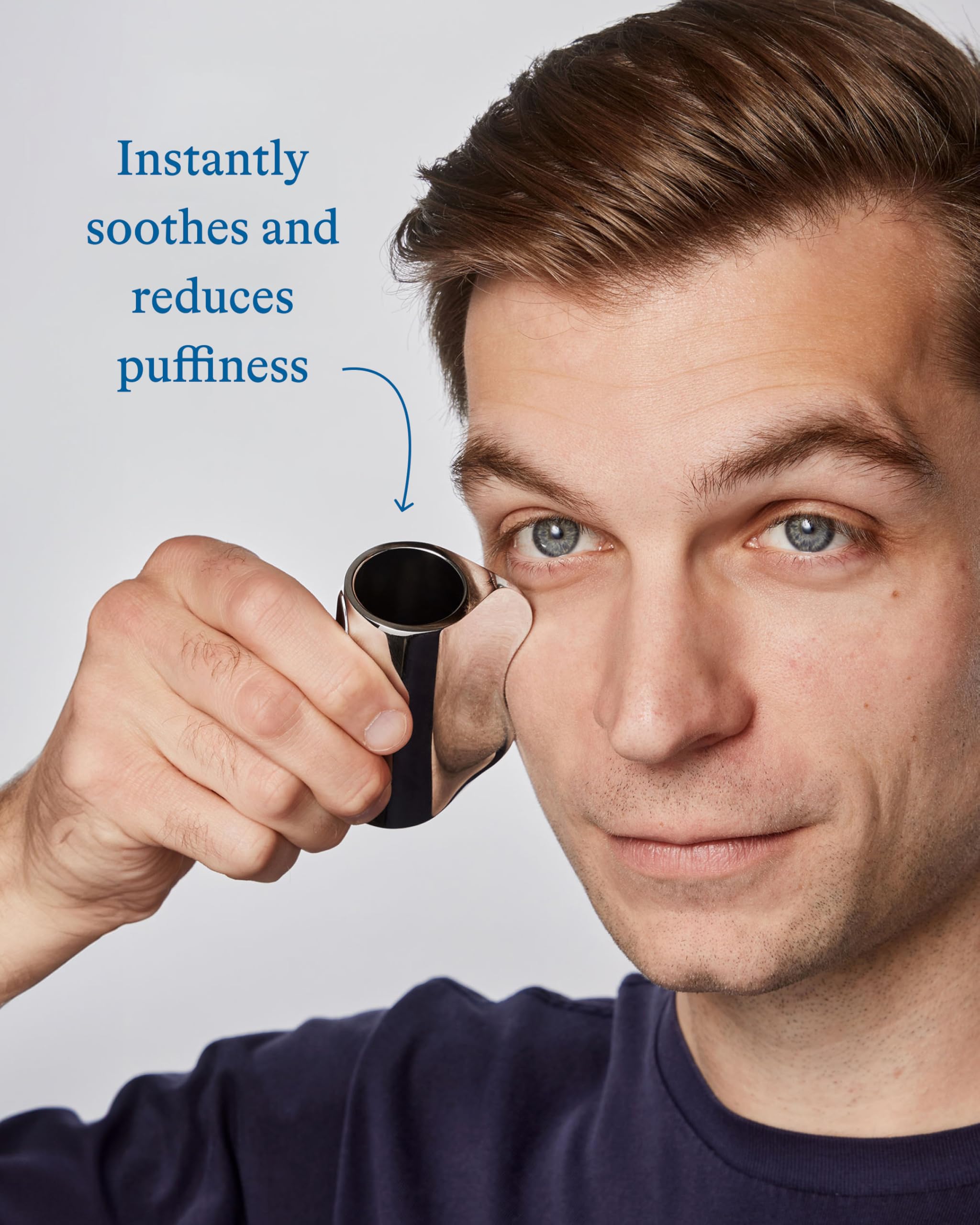 Harry's gua sha tool detail highlighting weighted zinc and ergonomic shape