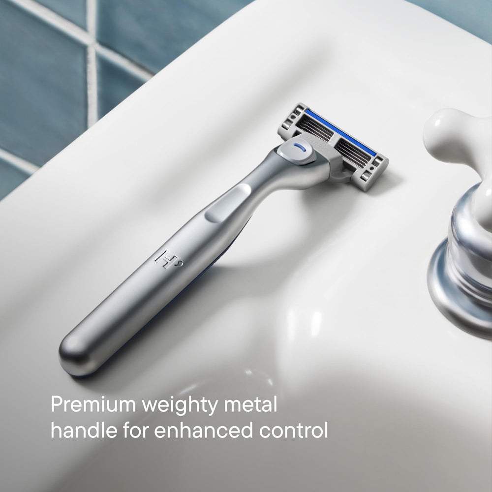 Harry's Plus push-button eject close-up illustrating easy blade changes and hygiene benefit
