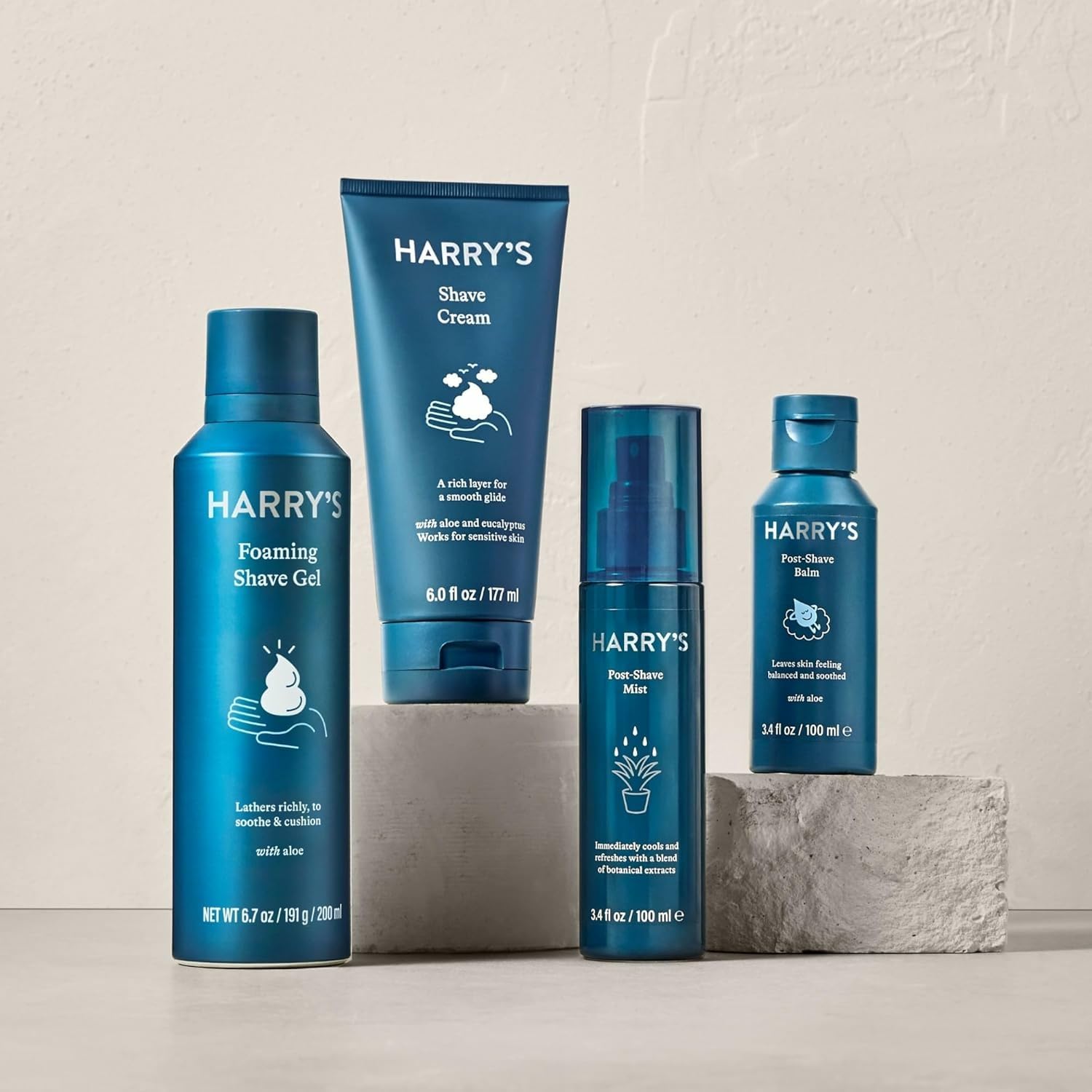 Harry's tube beside a razor to show 3.4 oz scale and readiness for daily shaving