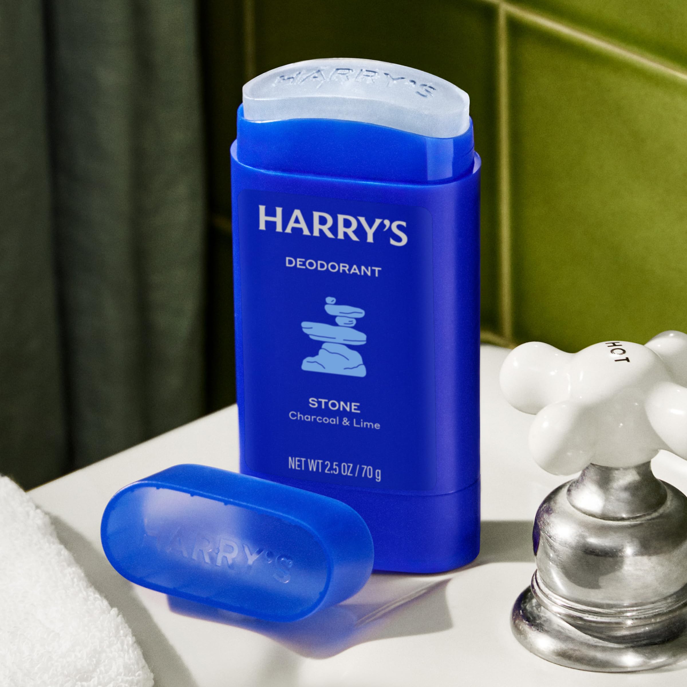 Applying Harry's Stone deodorant underarm demonstrating comfortable wear