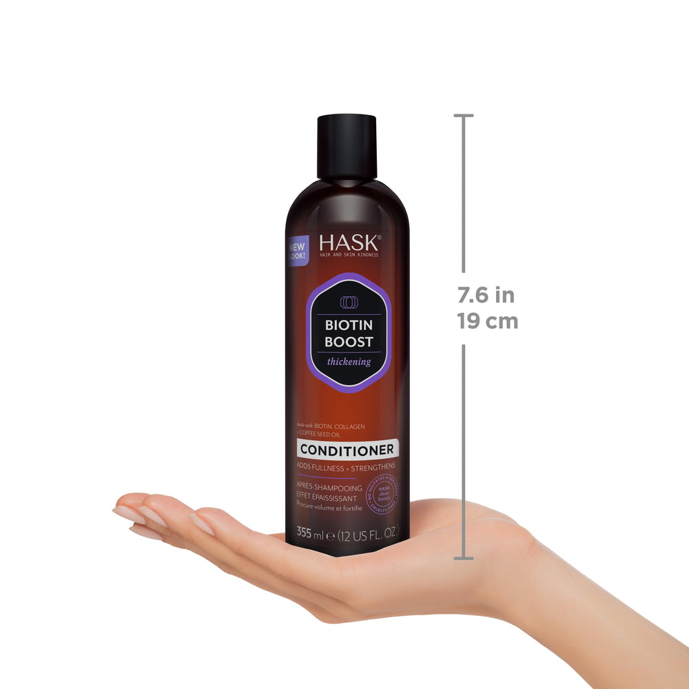 HASK bottles held in hand showing 12oz size and travel scale