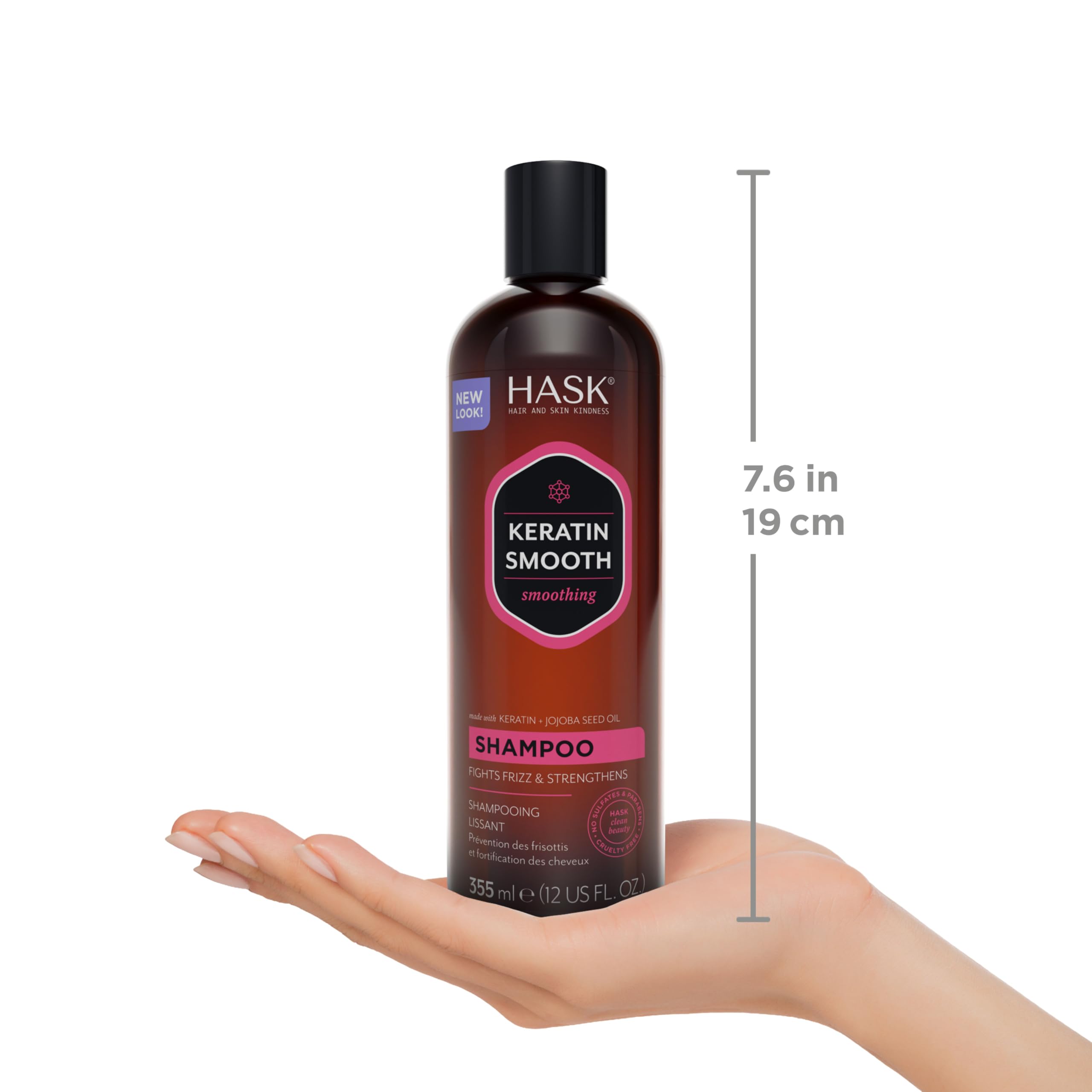 HASK bottles next to hand showing 12oz size for scale