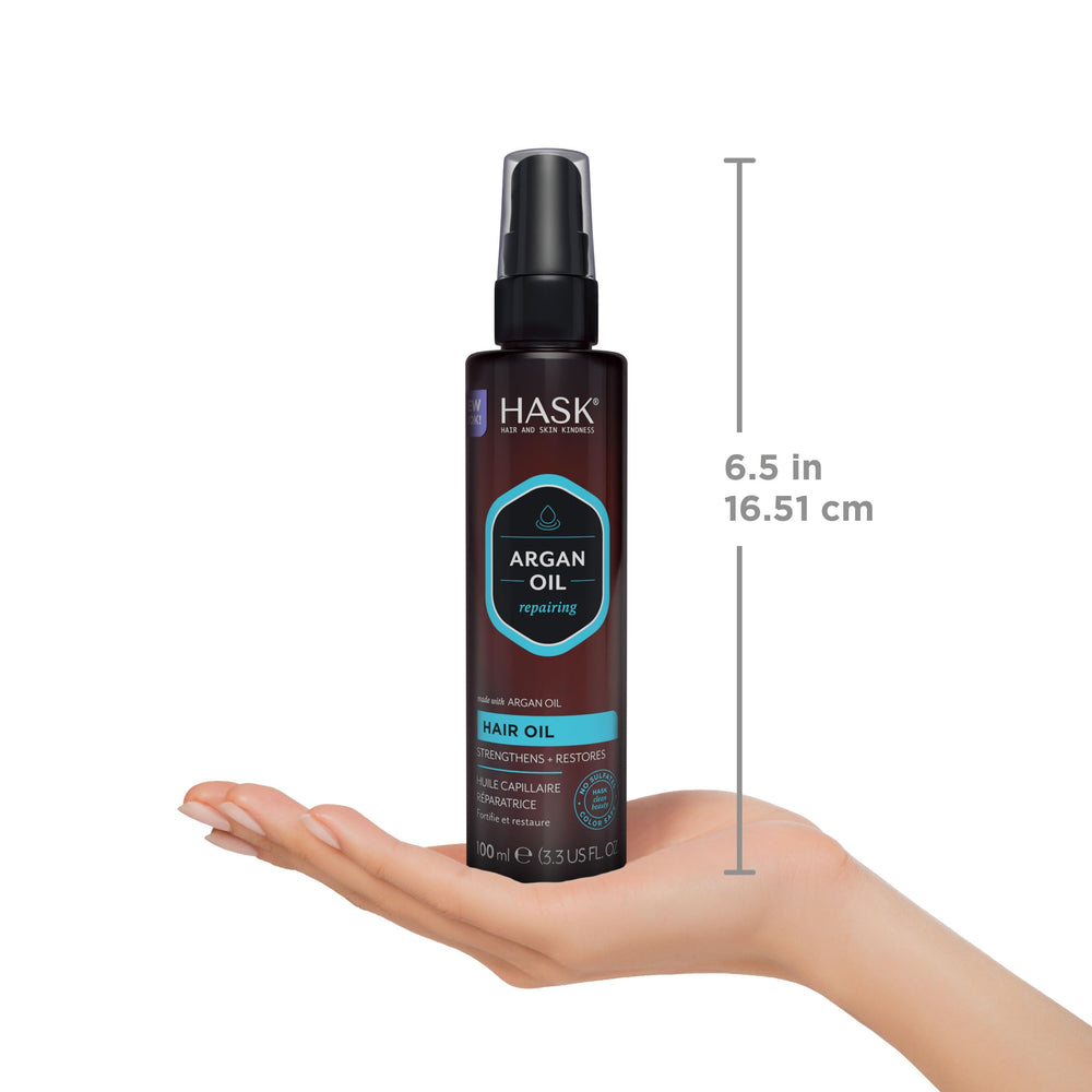 HASK bottle held in hand to show size and travel-friendly convenience
