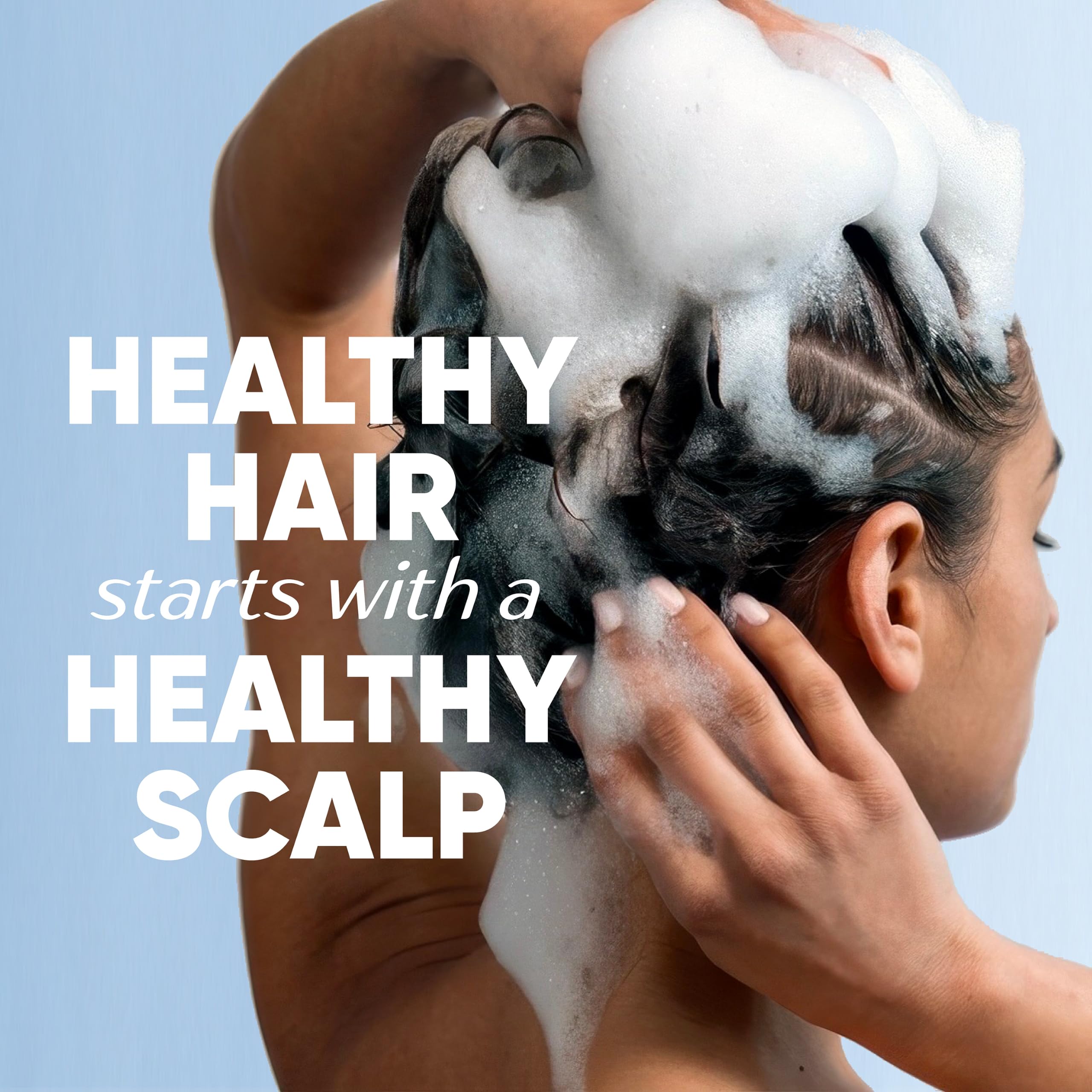 Applying Head & Shoulders to scalp, demonstrating targeted dandruff treatment