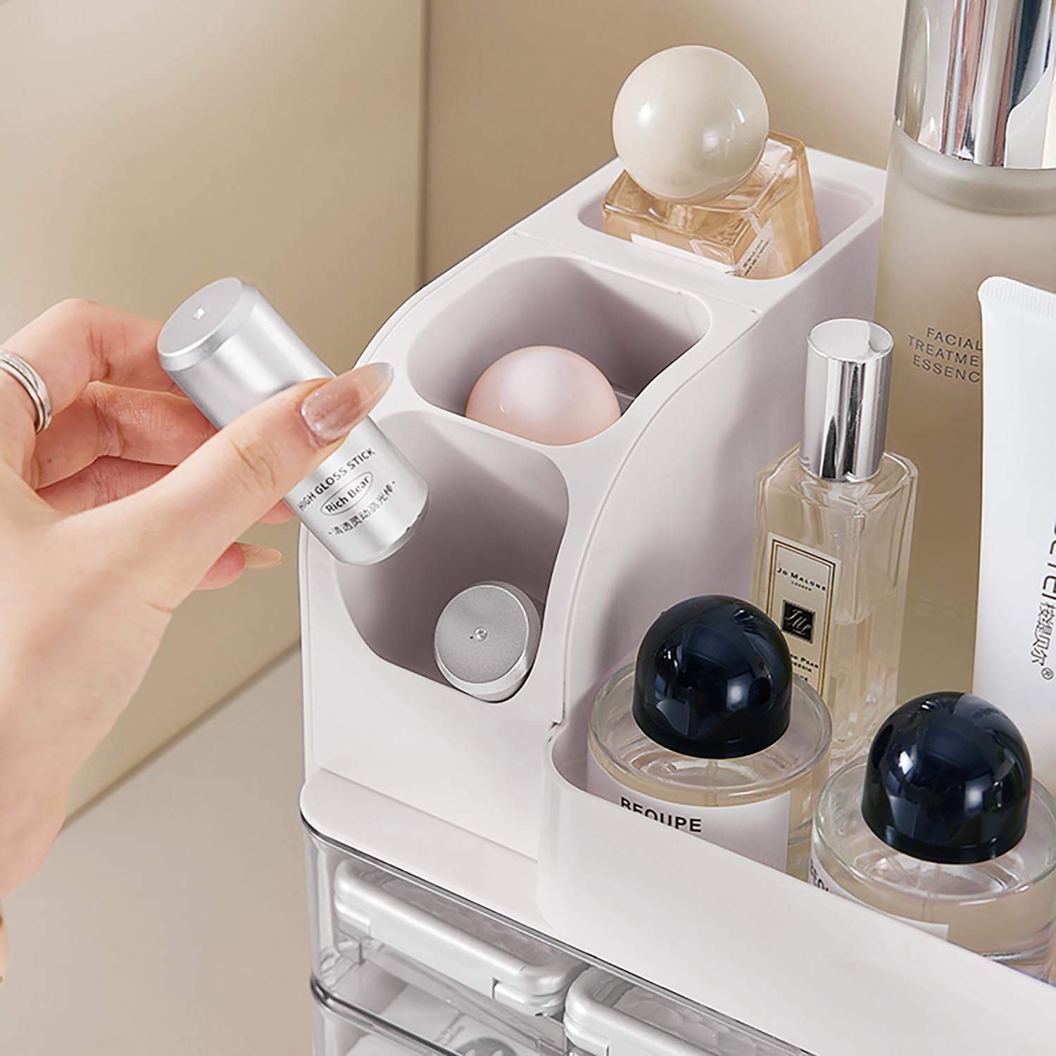 Heaime size comparison on bathroom counter demonstrating compact footprint