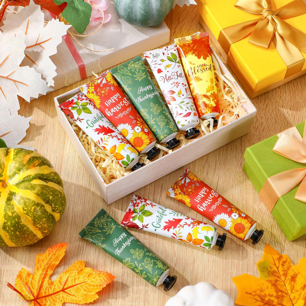 Heigble tubes lined up displaying pumpkin cinnamon apple orange vanilla scent variety