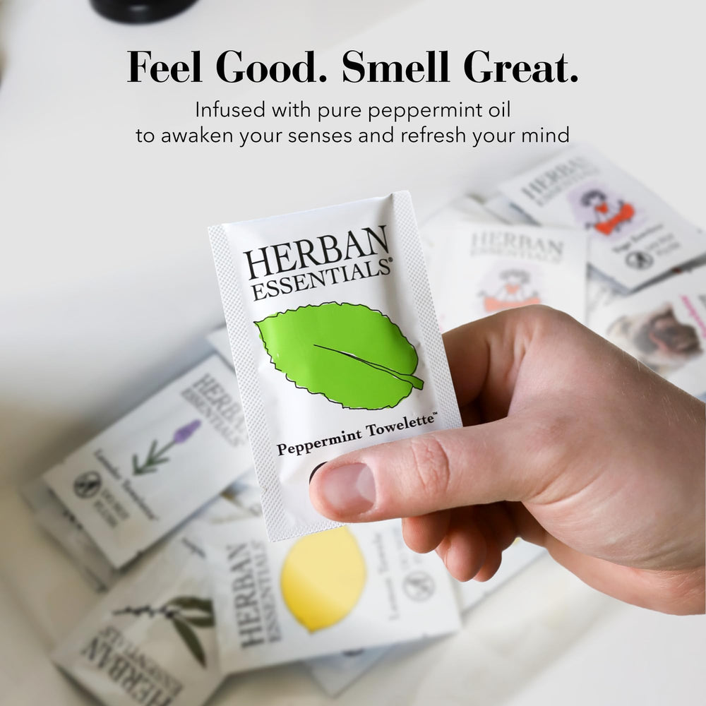 Herban Essentials wipe held in hand for scale and immediate on-the-go refresh benefit
