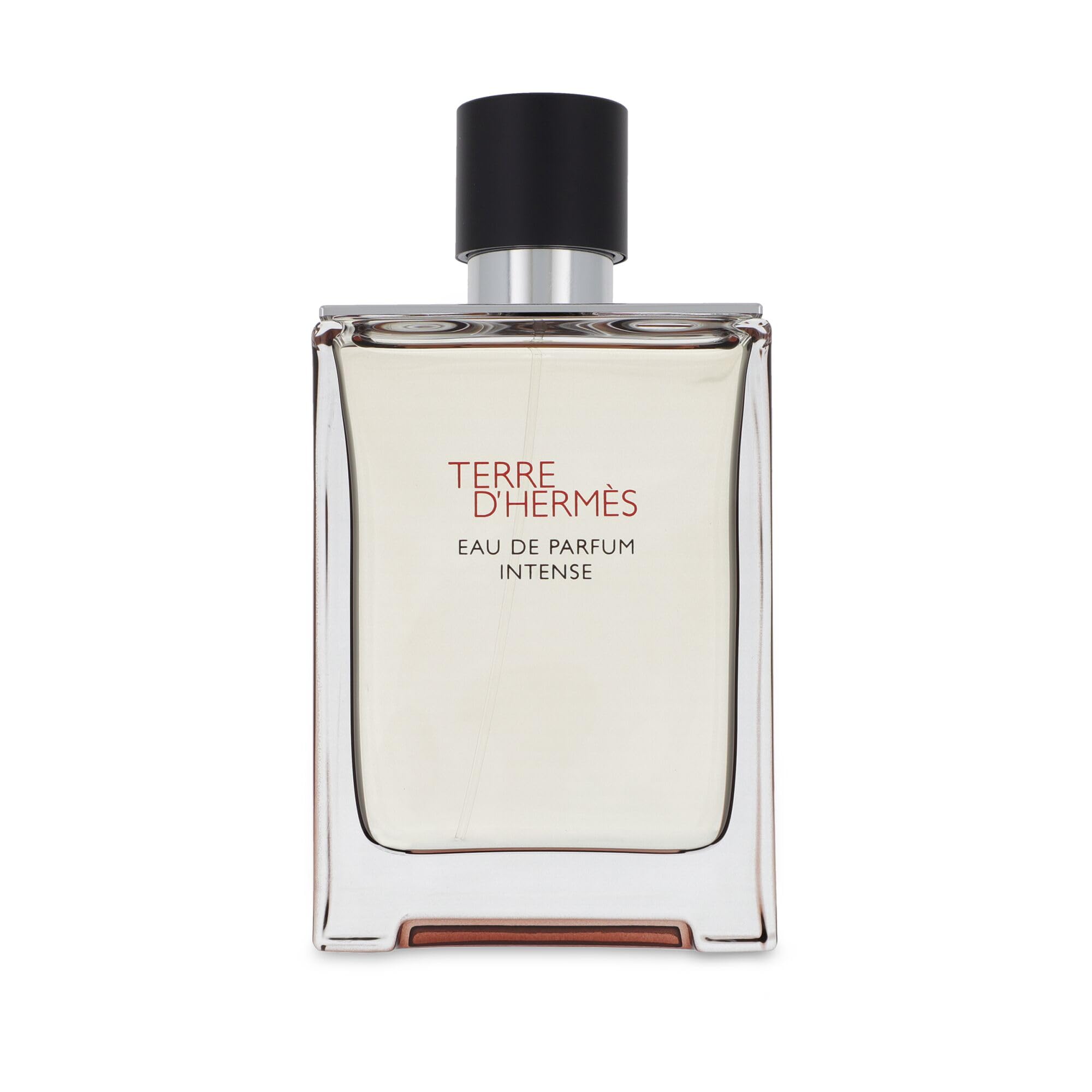 Hermès bottle close-up highlighting cap and glass texture for refillable benefit