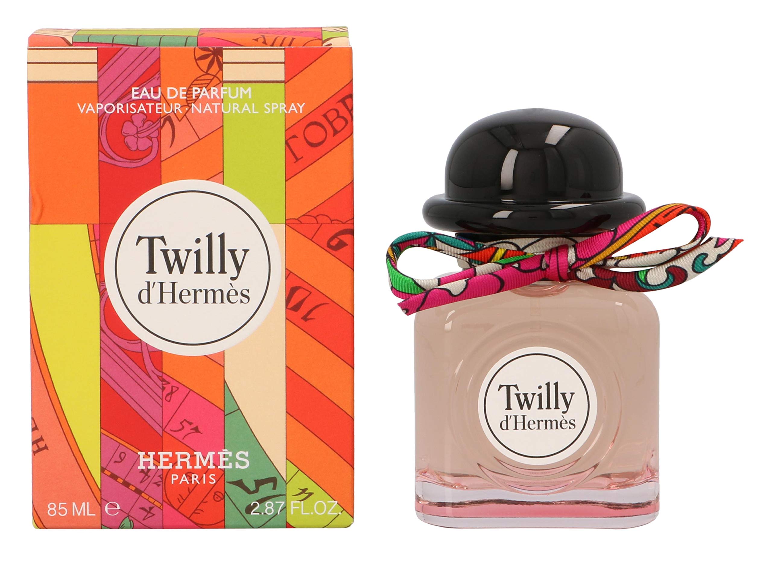 Hermès Twilly d'Hermès on vanity with styling props, conveying travel-friendly sophistication