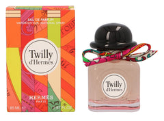 Hermès Twilly d'Hermès on vanity with styling props, conveying travel-friendly sophistication