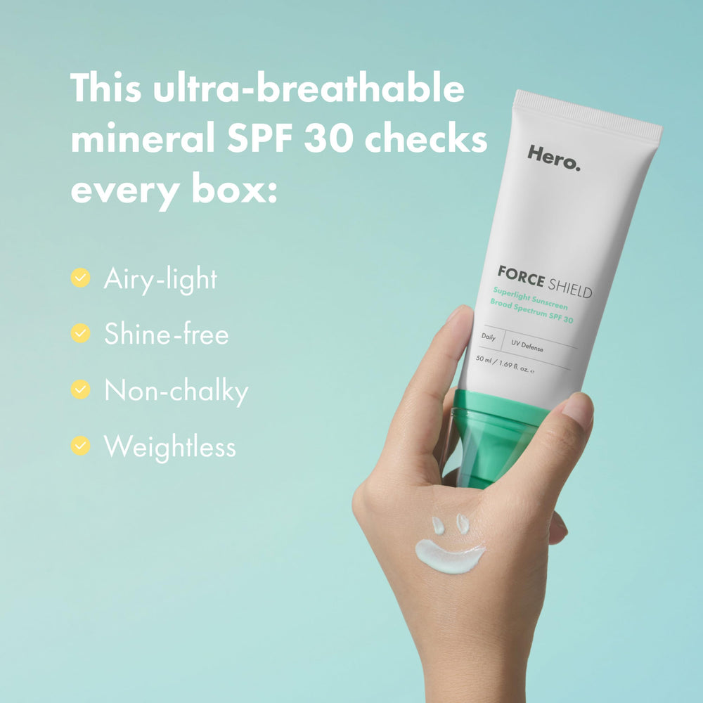 Hand applying Hero Cosmetics Force Shield on back of hand, demonstrating fast-absorbing finish