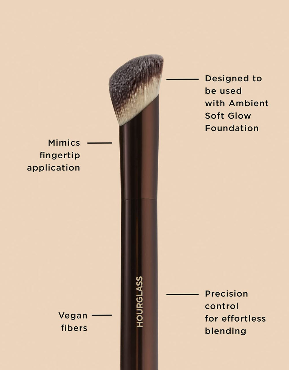 Hourglass brush in use blending foundation for seamless finish