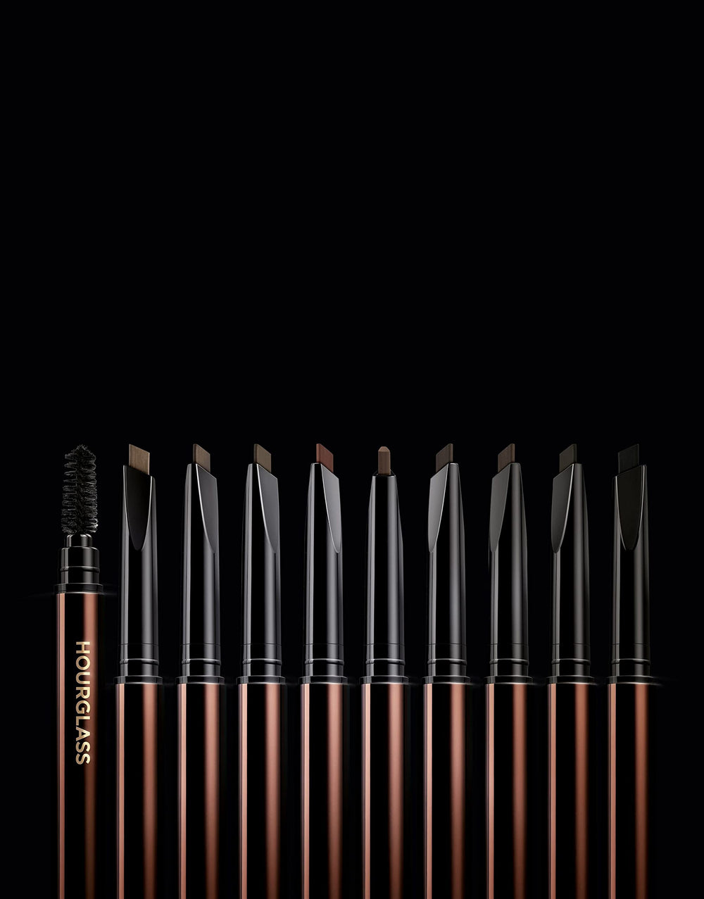 HOURGLASS spoolie blending product on brow for natural-looking, groomed arch