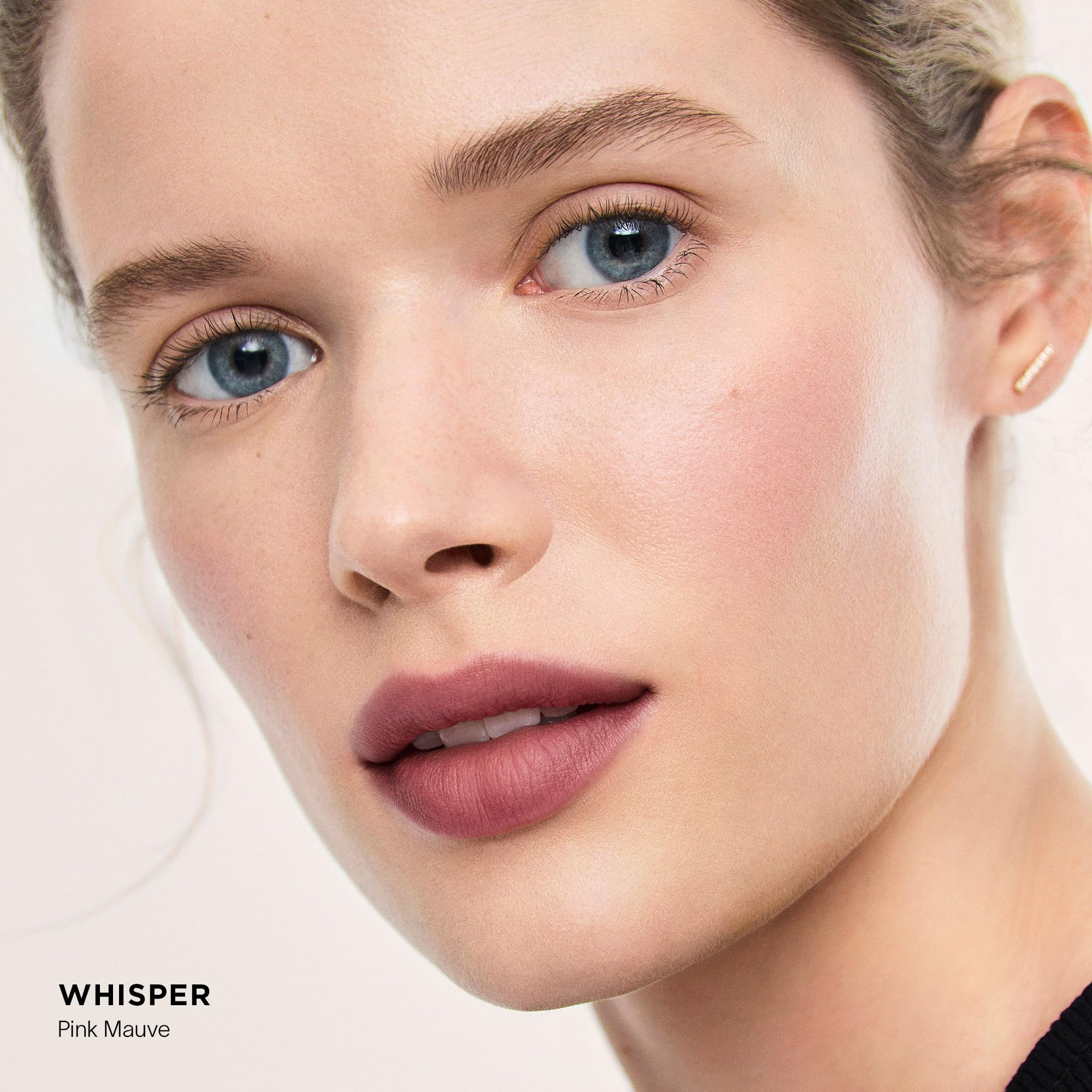 HOURGLASS balm applied to lips demonstrating blurred lines and softer appearance