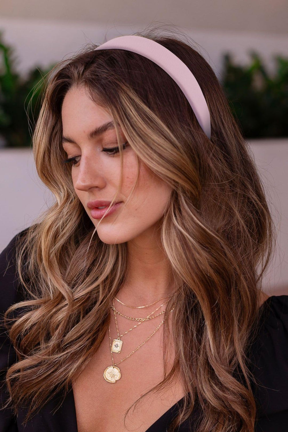 Huachi headband securing an updo, demonstrating no-pull comfort benefit