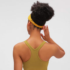 Huachi headbands beside a ruler illustrating stretch and true-to-size fit