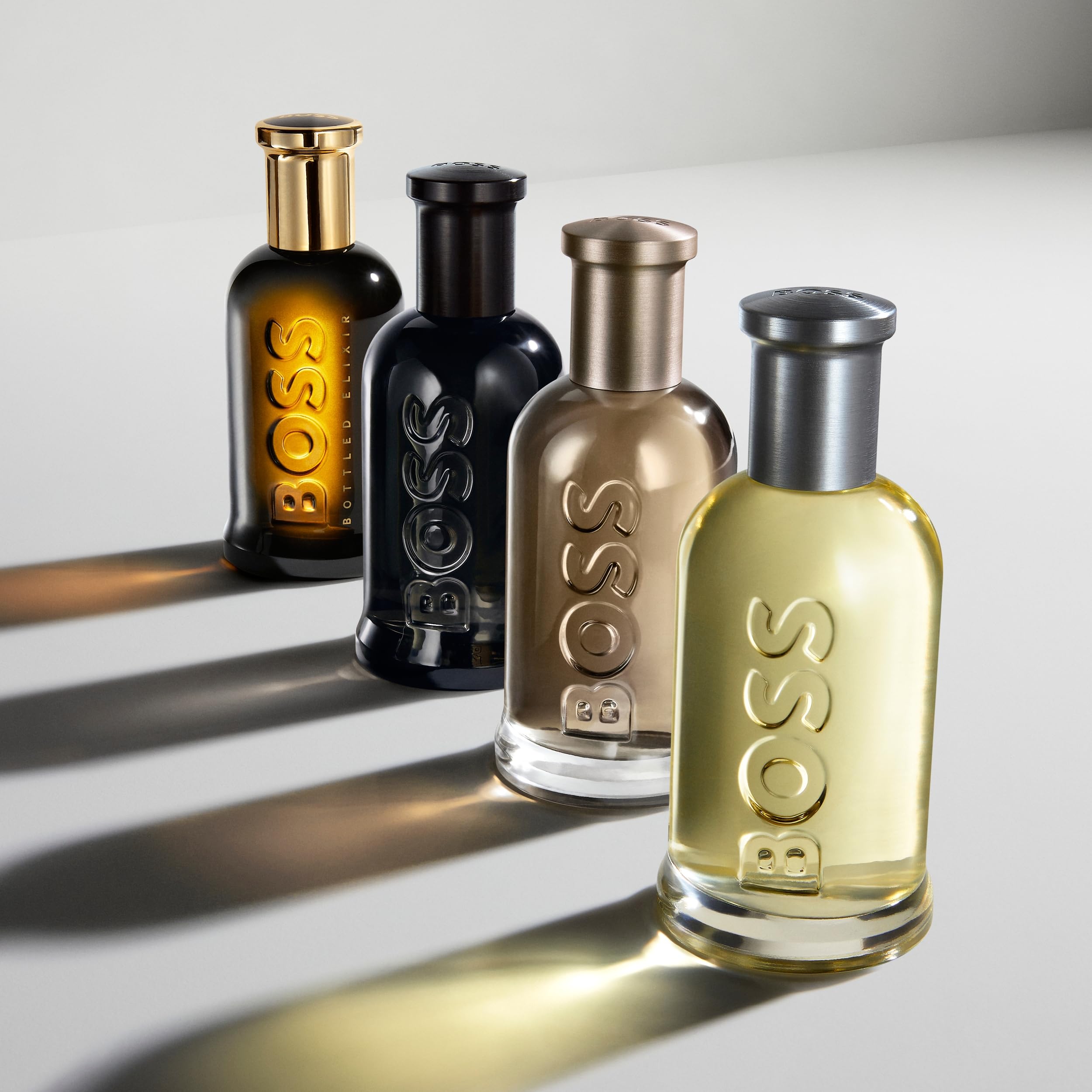 Close texture shot of sandalwood and vetiver ingredients with Hugo Boss label, emphasizes warm base