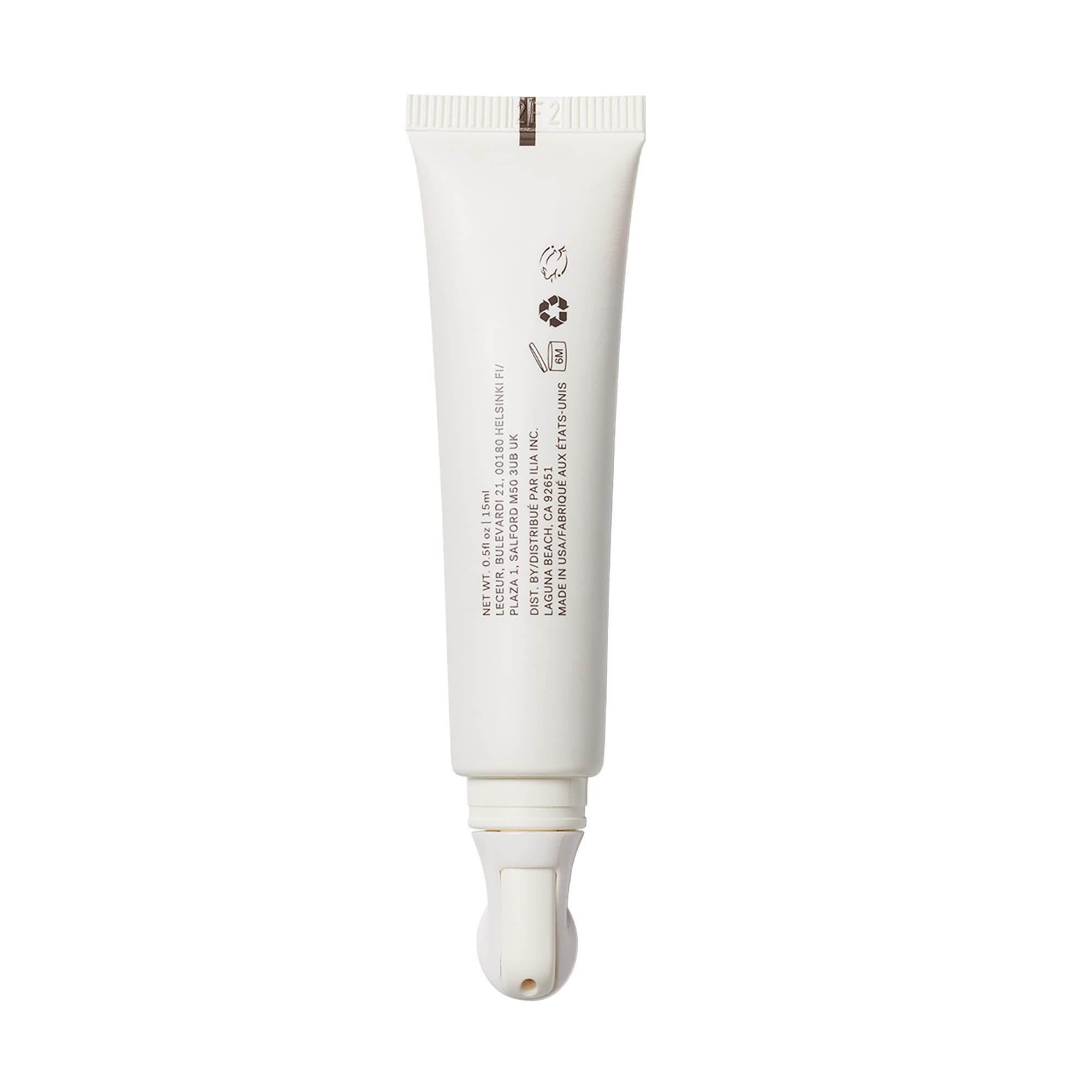 ILIA cream on fingertips ready to apply for smooth under-eye benefit