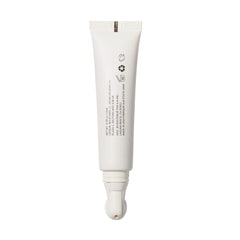 ILIA cream on fingertips ready to apply for smooth under-eye benefit