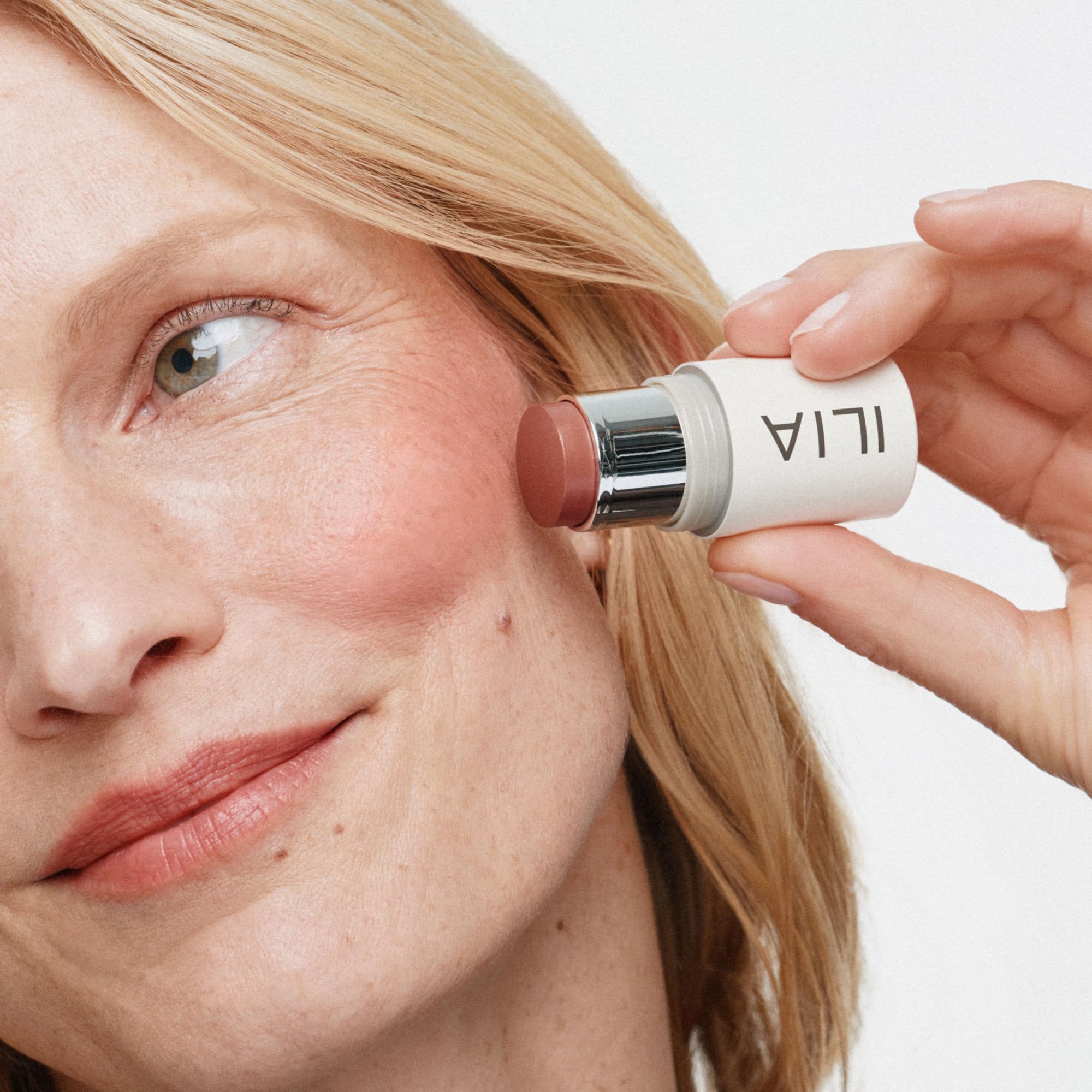 ILIA multi-stick applied to lips closeup showing a comfortable, flattering tint benefit