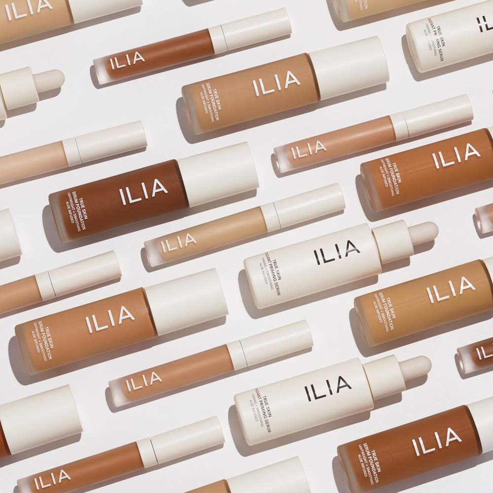 ILIA serum on vanity being applied offering radiance-boosting benefit