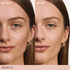 ILIA concealer wand applicator poised to spot conceal with precise control