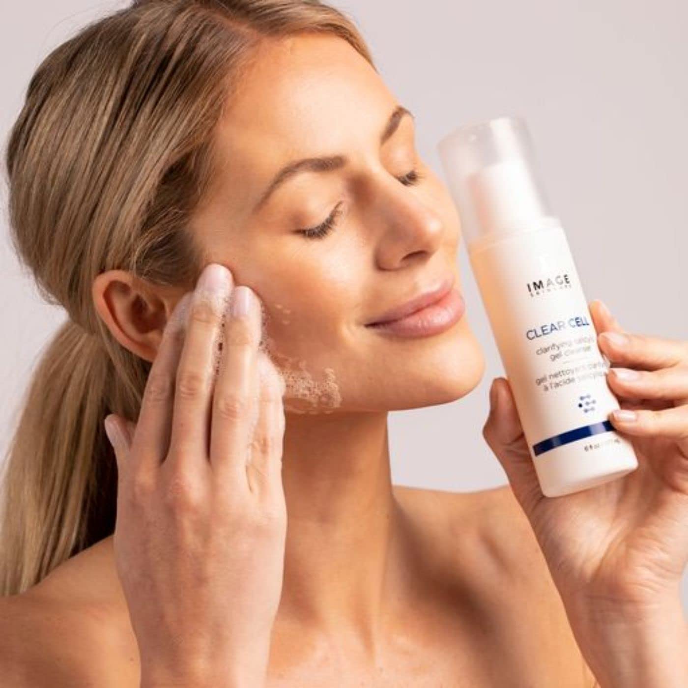 IMAGE Skincare cleanser staged in bathroom routine showing daily use benefit