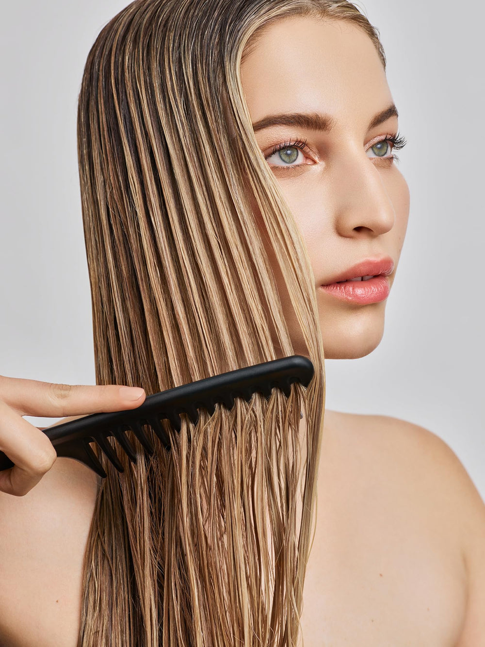 IN COMMON stylist using Magic Myst during blow-dry for heat protection