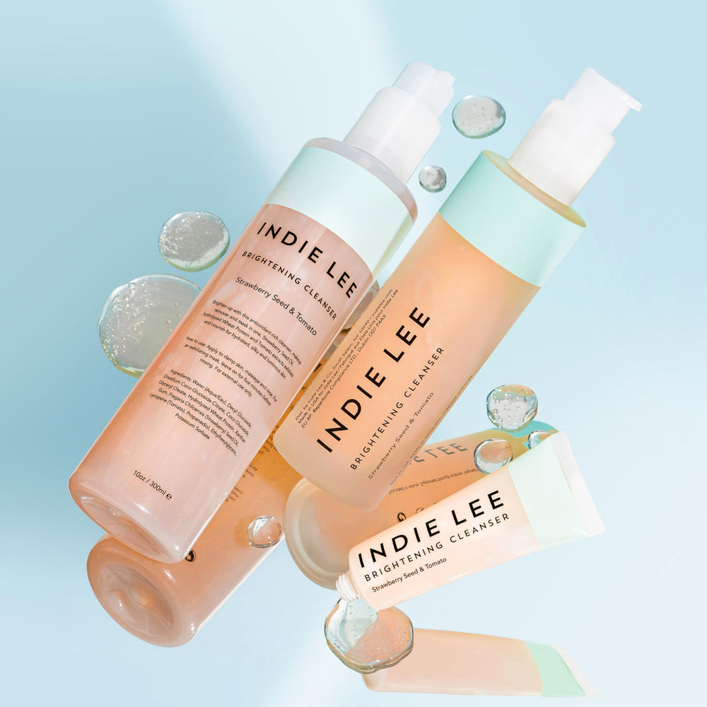 Indie Lee mask on cheek close-up showing exfoliating brightening effect