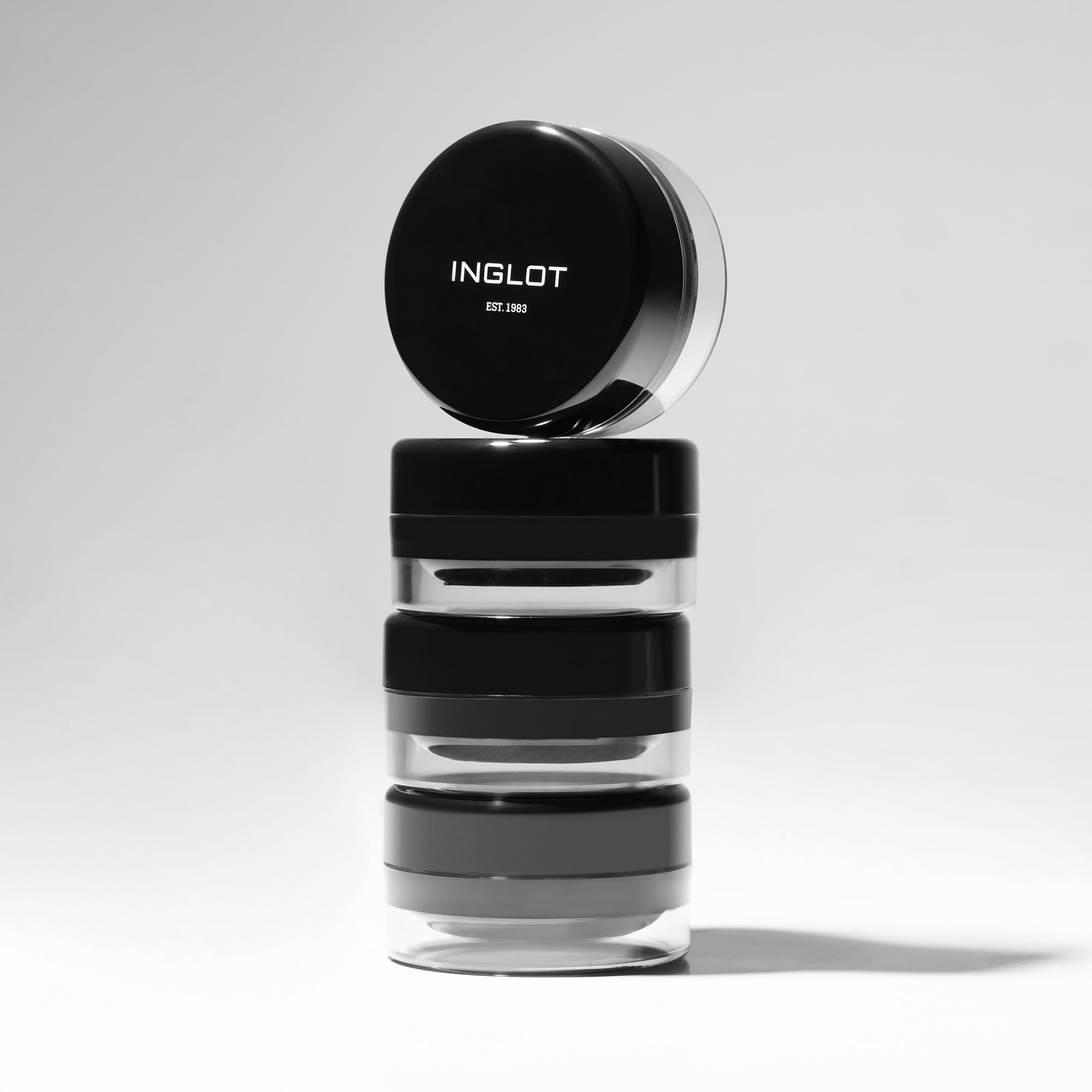 Inglot eyeliner next to coin shows 5.5 g scale for portability benefit