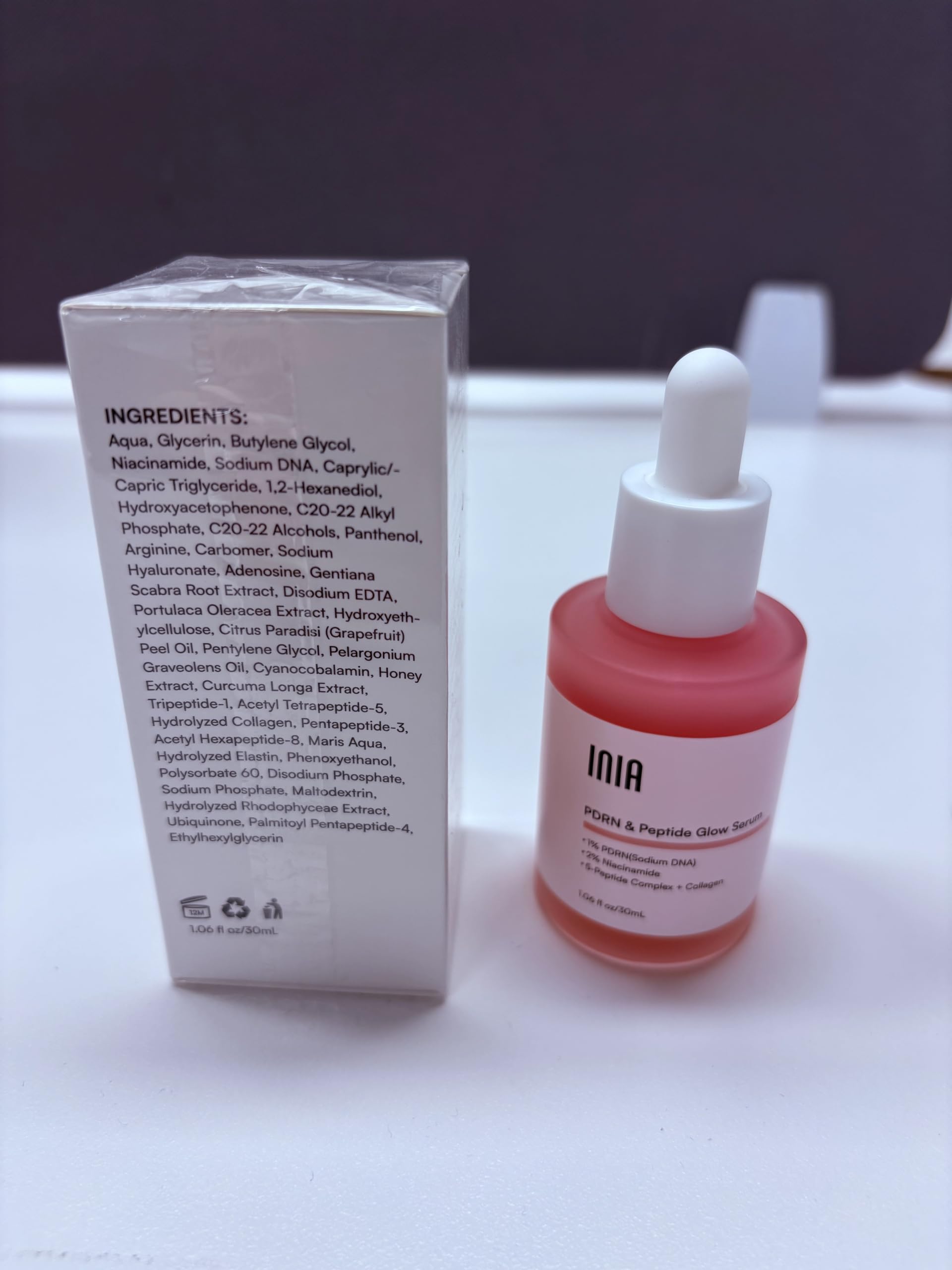 INIA serum applied on skin close-up displaying hydrated finish