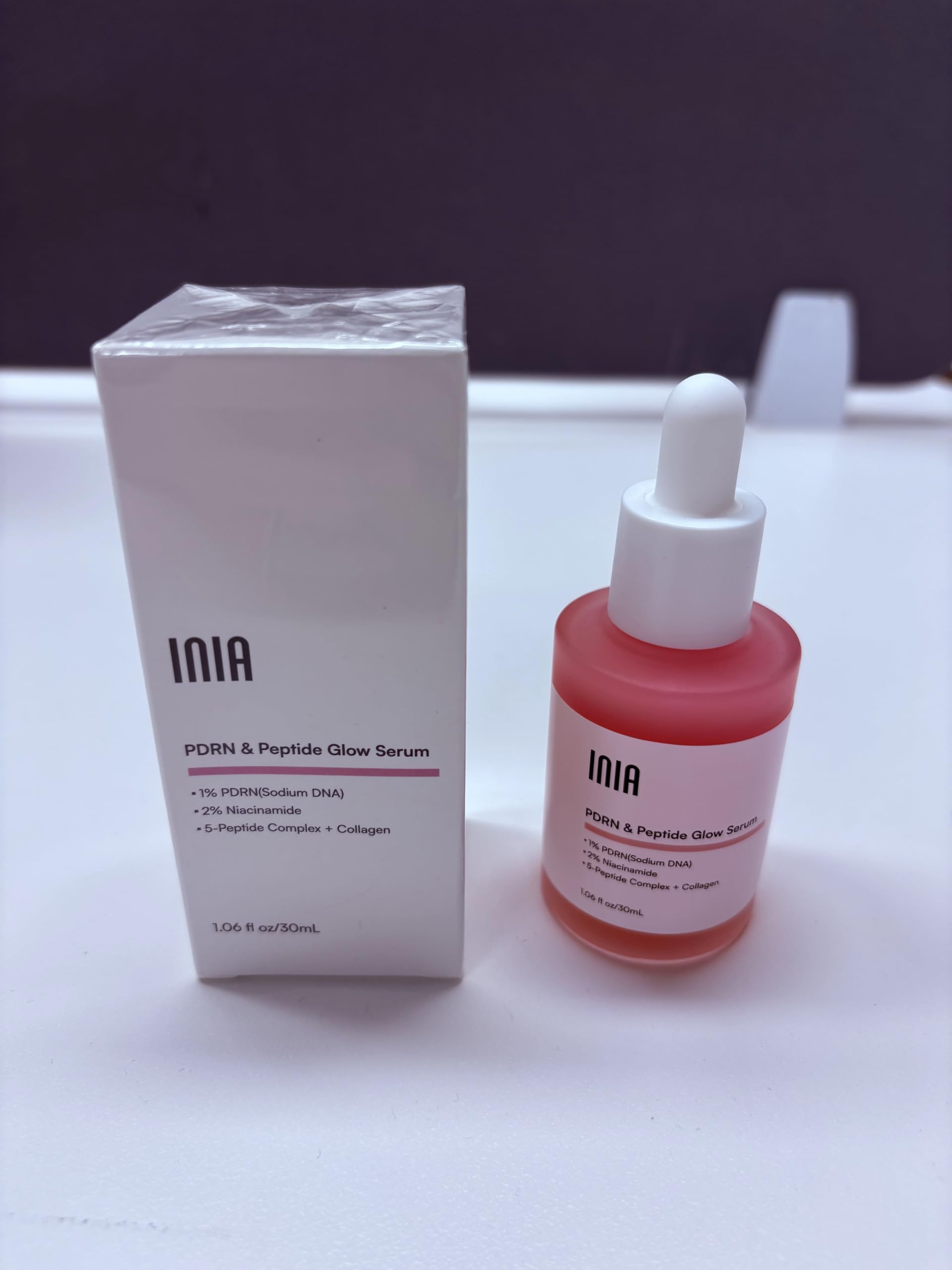 INIA bottle held in hand for size and scale reference