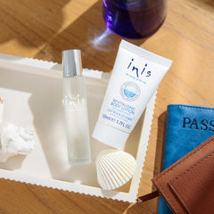 Inis cologne travel spray held in hand for convenient on-the-go refresh