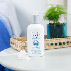 Inis hand lotion open cap and creamy texture demonstrating fast absorption