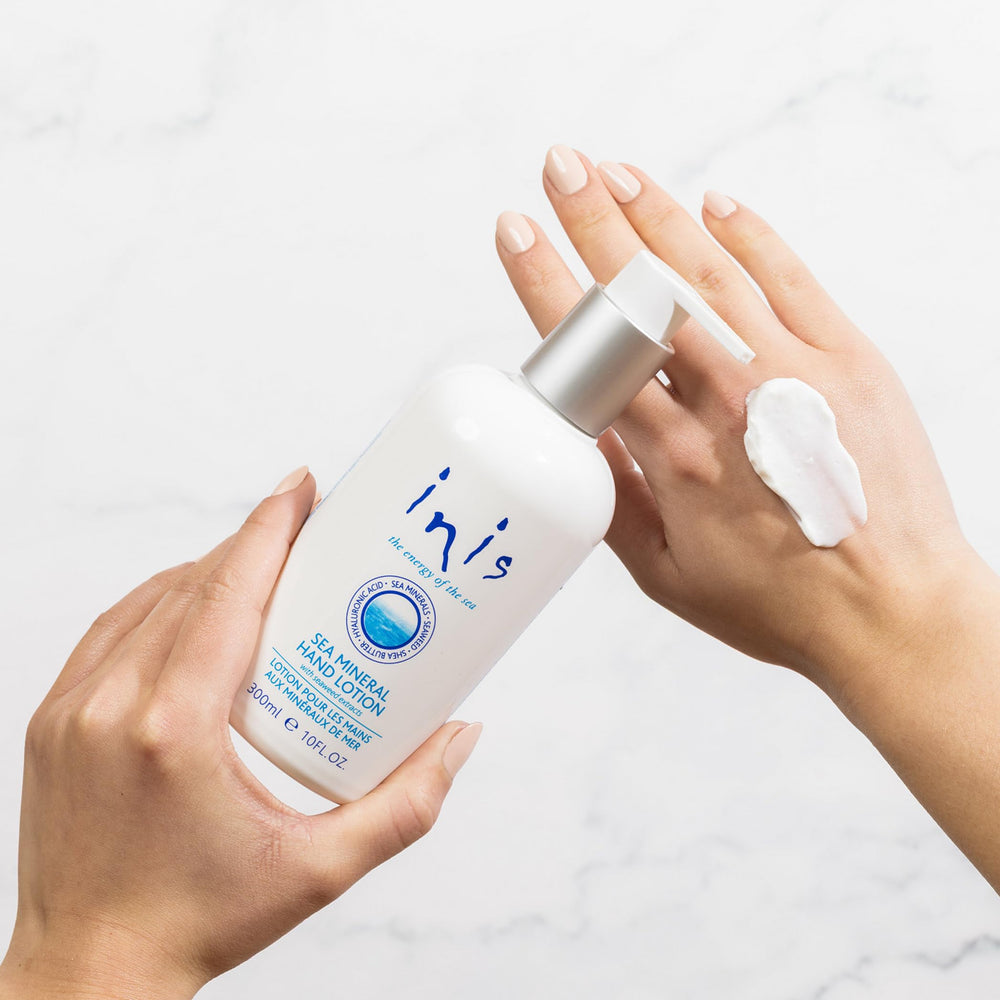 Inis hand lotion dispensing a drop highlighting lightweight hydration
