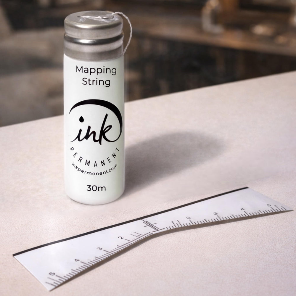Ink Permanent pre-inked string close-up showing clear guide line benefit