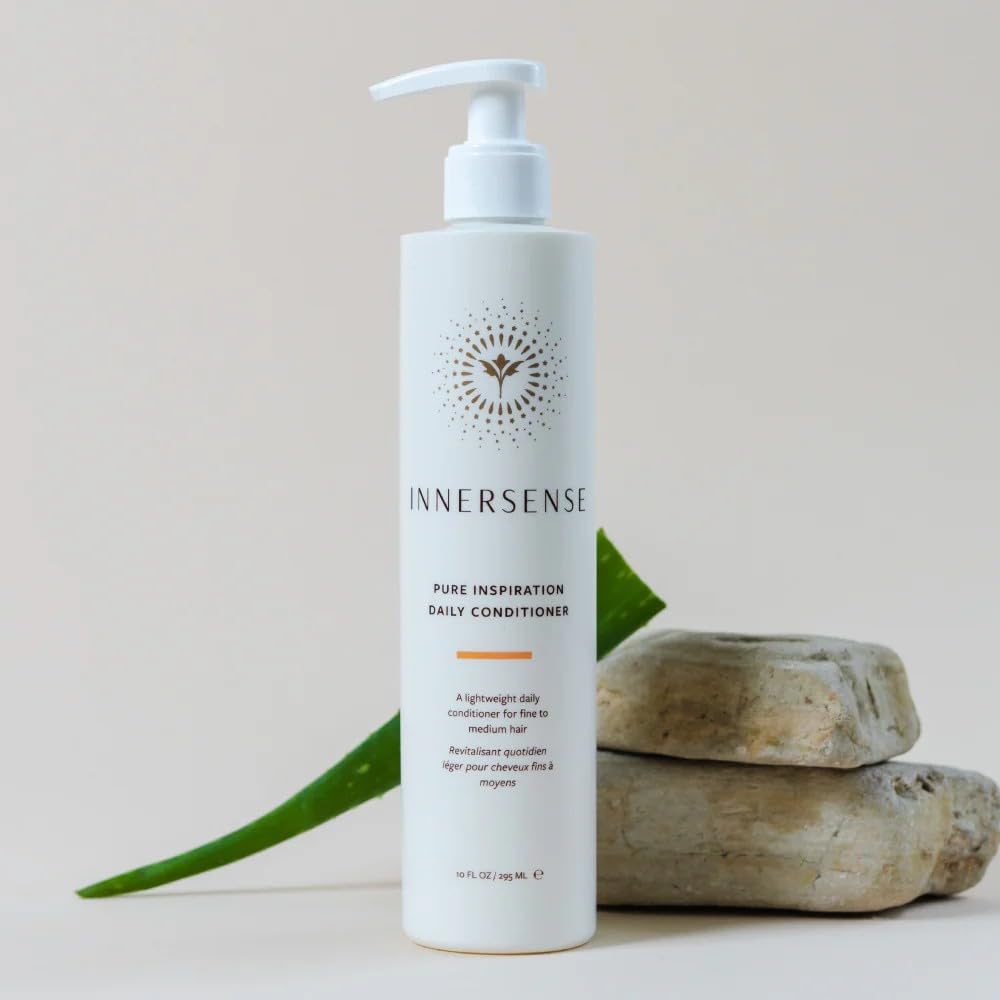 INNERSENSE bottles beside a hand for scale showing travel-friendly 10 fl oz size