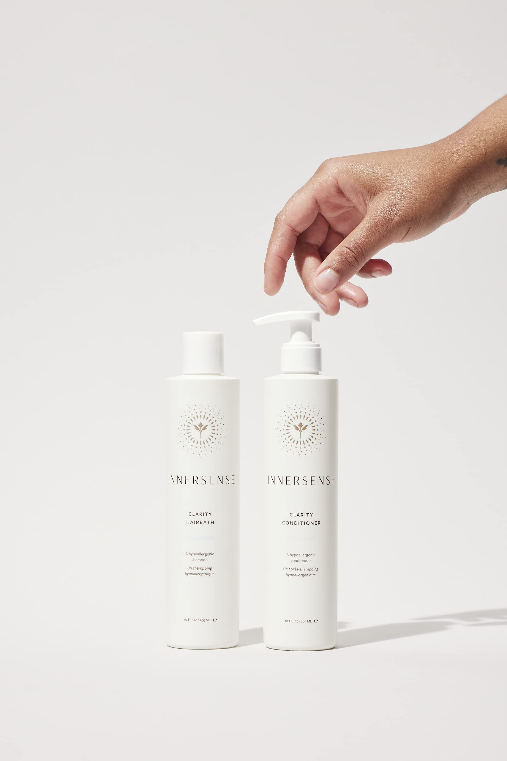 INNERSENSE Clarity conditioner pouring texture showing rich moisture and lightweight feel