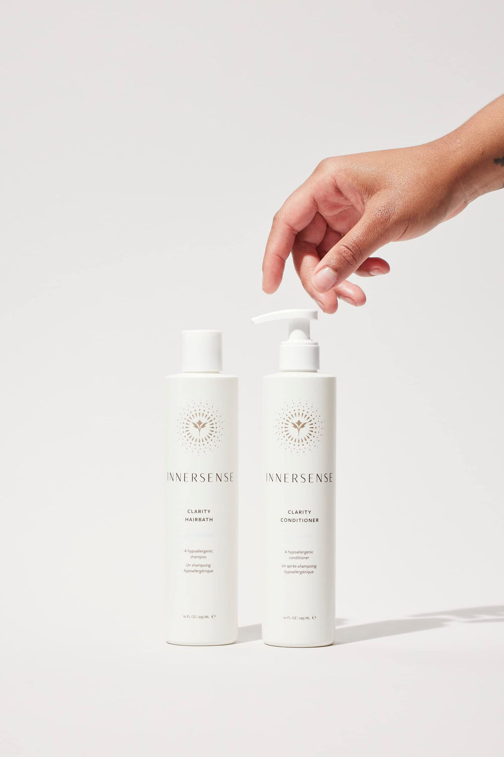 INNERSENSE Clarity conditioner pouring texture showing rich moisture and lightweight feel