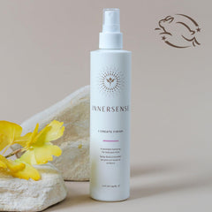 INNERSENSE close-up nozzle showing fine mist spray for even, lightweight application