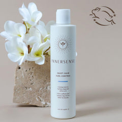 INNERSENSE product held in hand showing scale and salon-size convenience